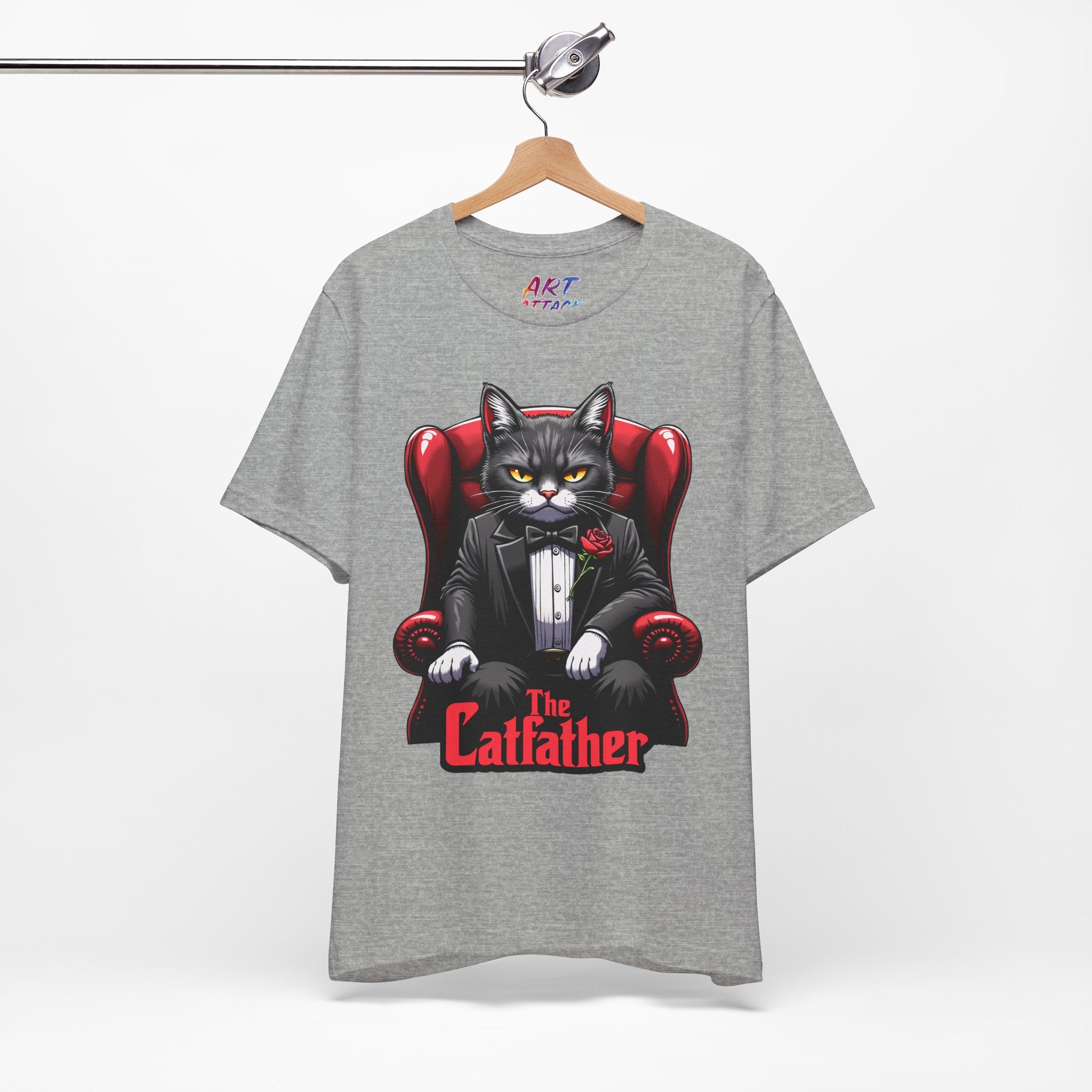 A serious grey cat dressed in a black tuxedo with a red rose on the lapel, sitting like a mafia boss in a red leather armchair with the text The Catfather below.