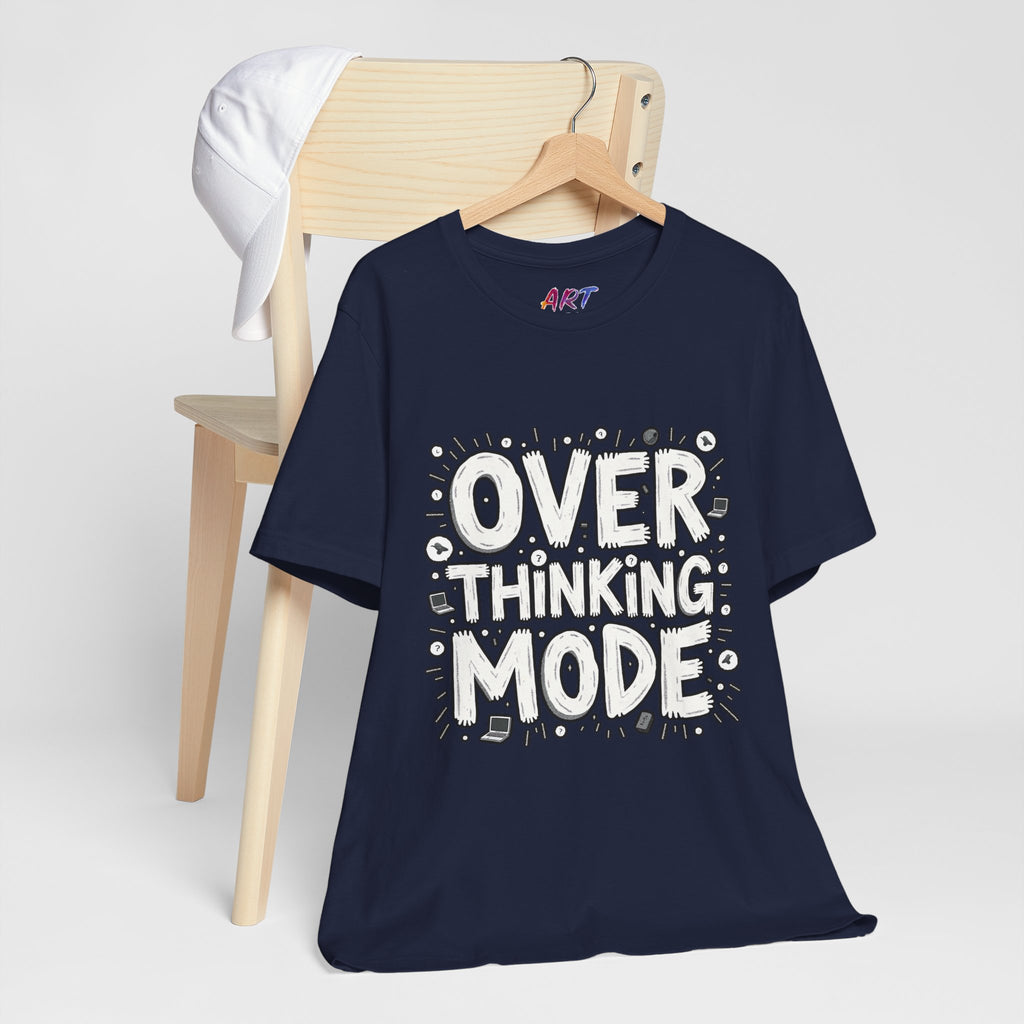 White hand-drawn typography saying Overthinking Mode with laptop and book doodles on a dark premium t-shirt.