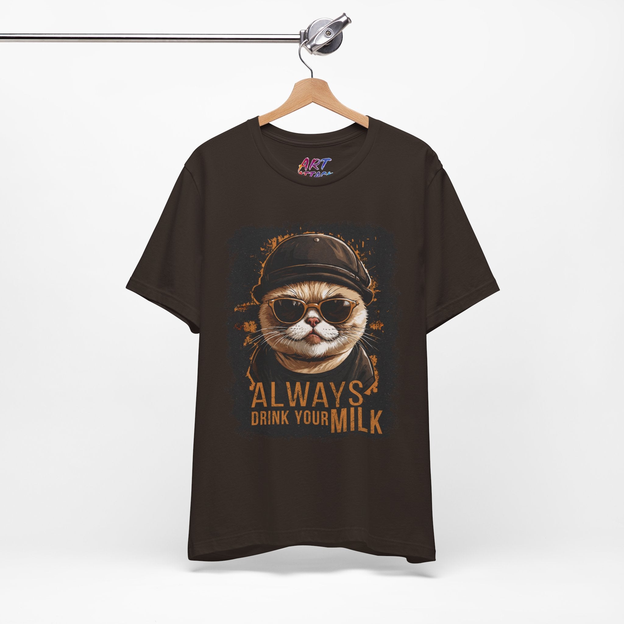 brown t-shirt with a cat graphic and text on a hanger against a white background