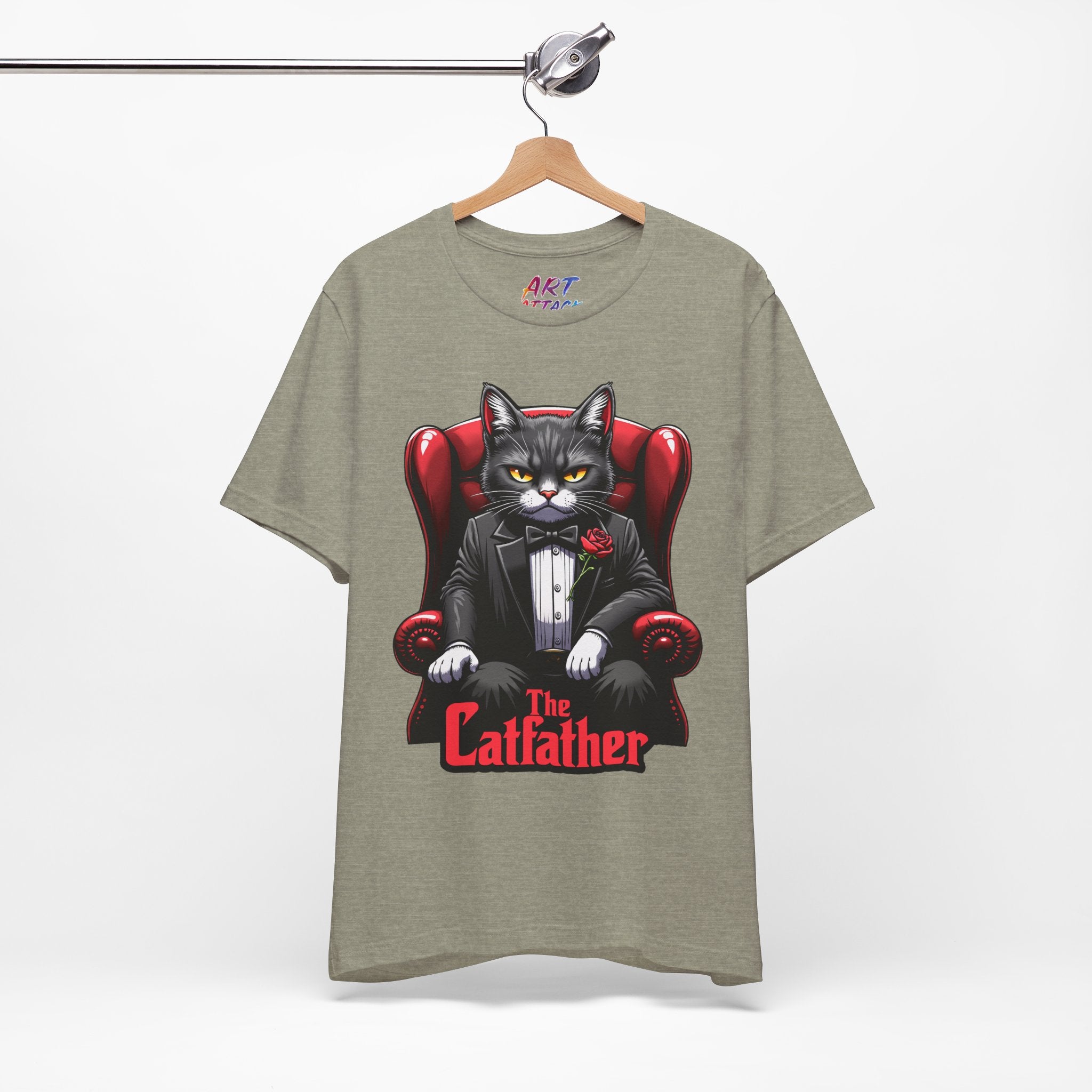 A serious grey cat dressed in a black tuxedo with a red rose on the lapel, sitting like a mafia boss in a red leather armchair with the text The Catfather below.