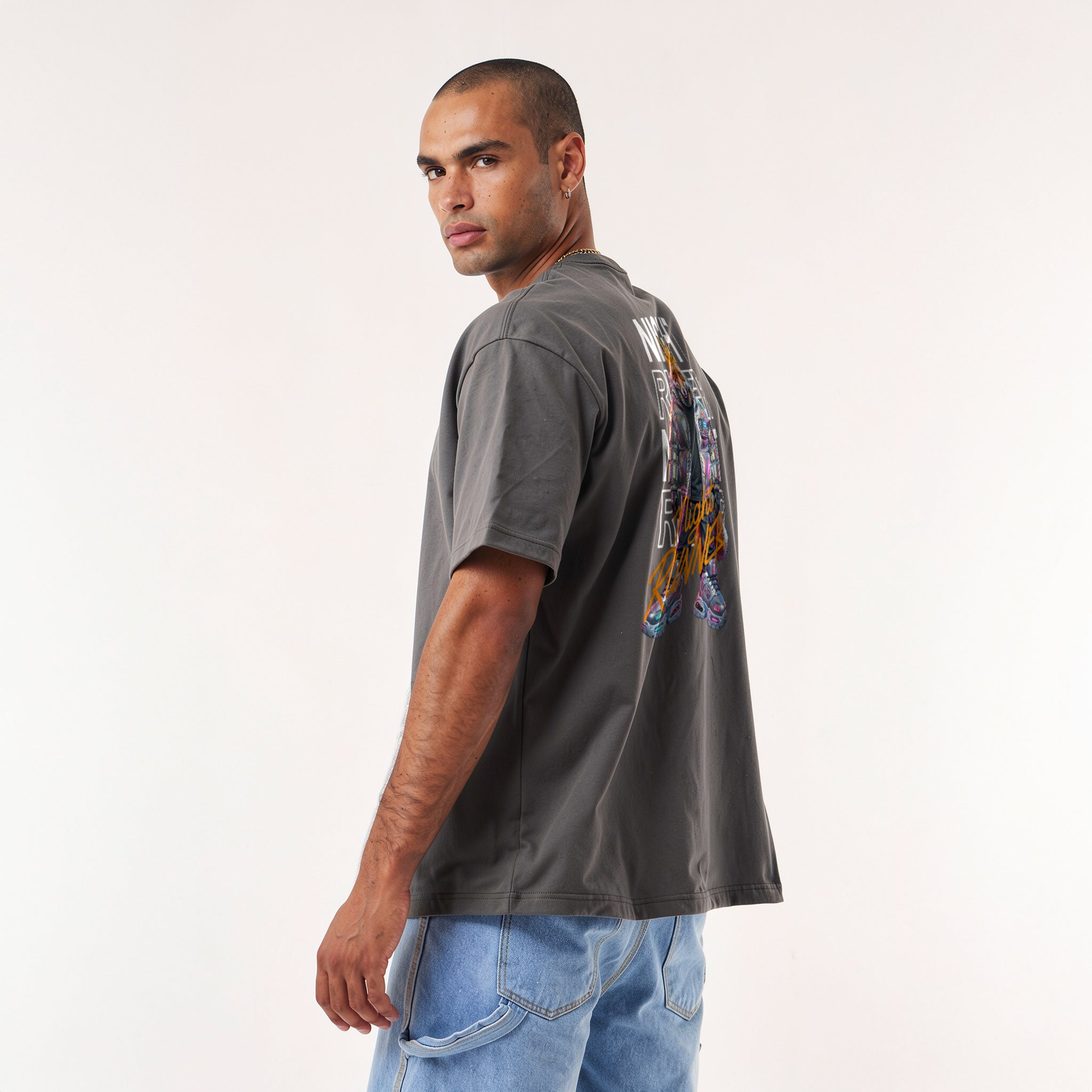 Oversized graphic streetwear t-shirt featuring a humanoid cyberpunk fox wearing an iridescent metallic puffer jacket and neon chunky sneakers, with the text Night Runner.